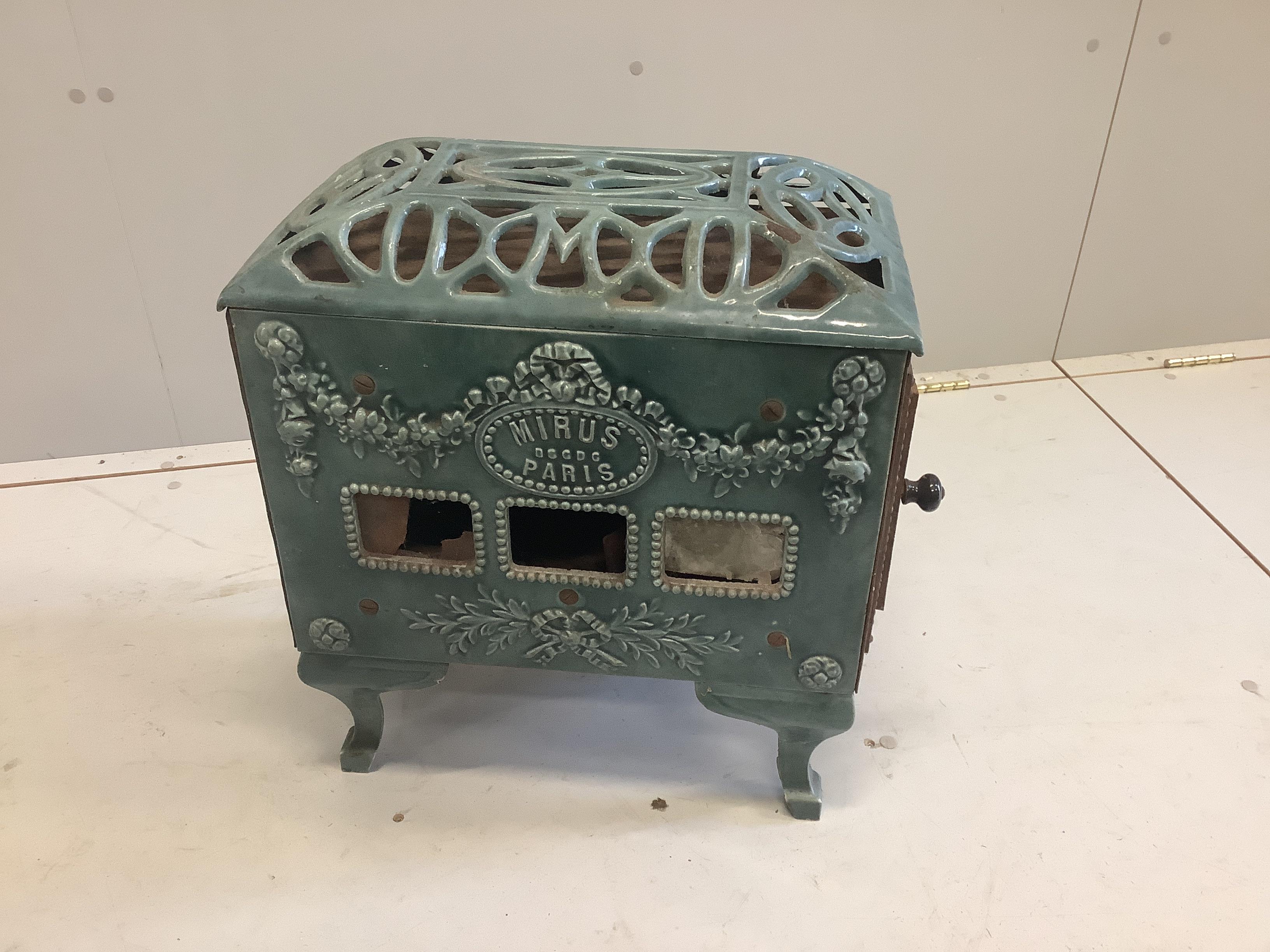 An early 20th century 'Mirus' enamelled cast iron heater, width 47cm, depth 26cm, height 54cm